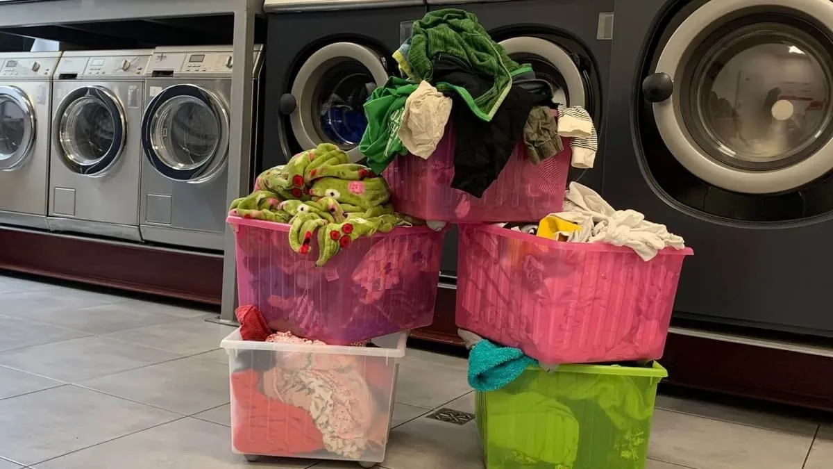 Laundry baskets in front of the washers at Frania Cafe
